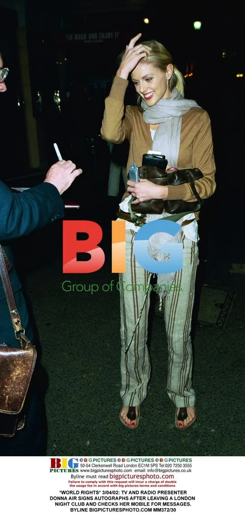 Donna Air signs autographs after London night club