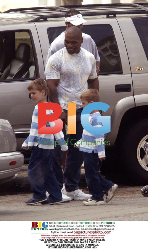Mike Tyson rides in Bentley with girlfriend
