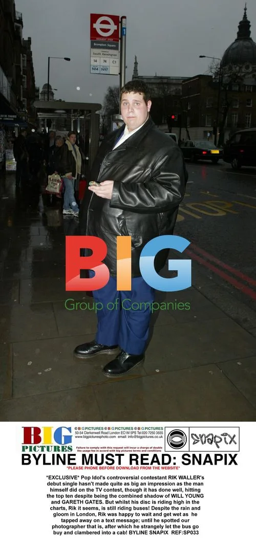 Pop Idol Contestant RIK WALLER Waits for Bus in London
