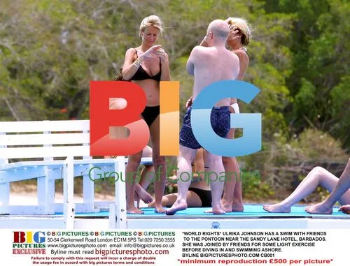 Ulrika Johnson swims with friends in Barbados