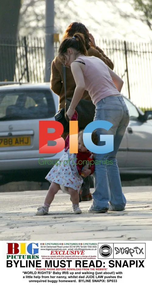 Baby IRIS takes steps with nanny, Jude Law