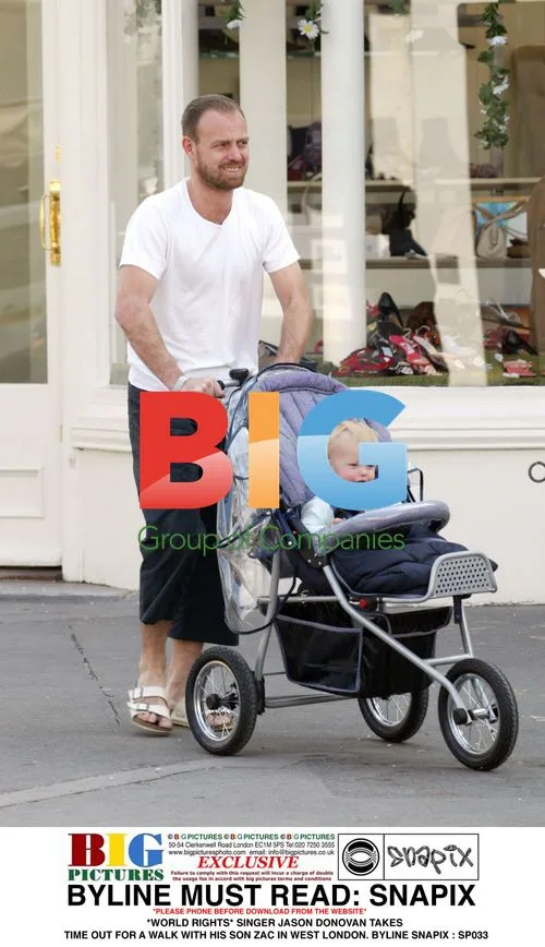 Jason Donovan Takes Walk with Son Zac