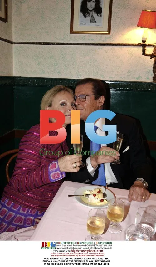 Roger Moore and wife Kristina dining in Rome