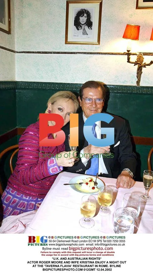 Roger Moore and wife Kristina dining in Rome