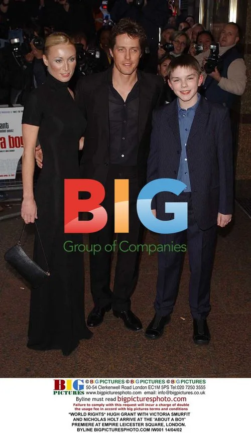 HUGH GRANT, VICTORIA SMURFIT, AND NICHOLAS HOLT AT "ABOUT A BOY" PREMIERE