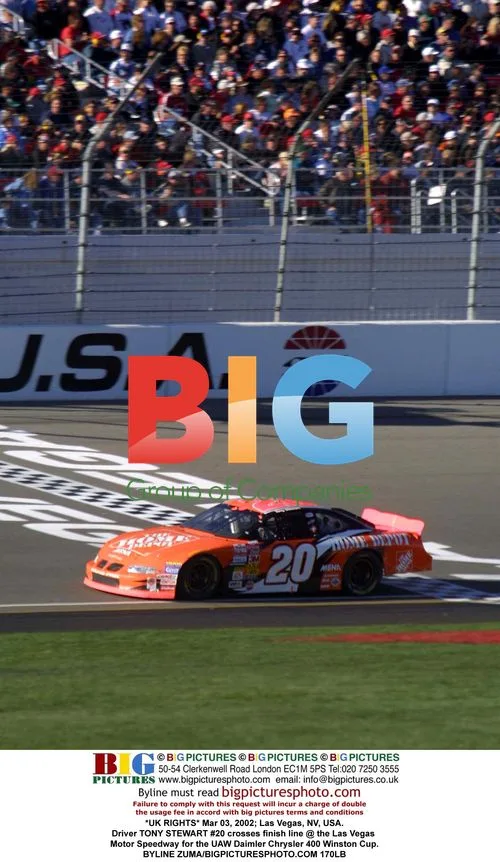 Tony Stewart #20 Crosses Finish Line