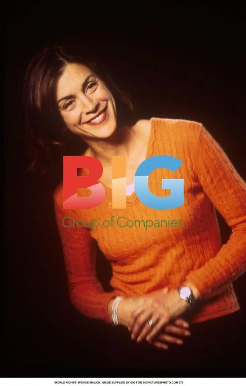 Wendie Malick in Orange Jumper