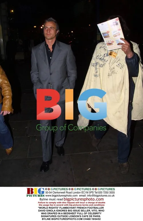 Footballer David Ginola Ignores Bedsheet Seller