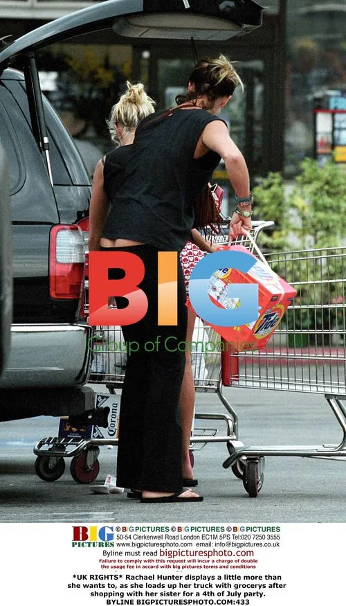 Rachael Hunter displays more while loading groceries
