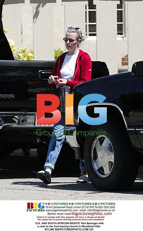 Kim Basinger leaving church in cast
