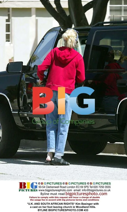 Kim Basinger leaving church with cast