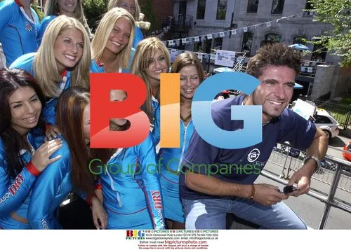 Cart driver ALEXANRE TAGLIANAI poses with babes