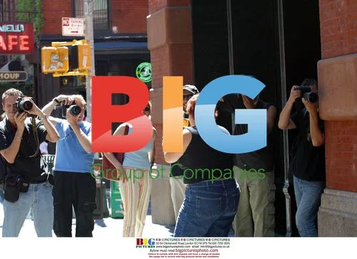 Katie Lucas fends off paparazzi