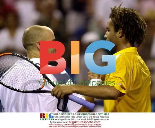 Andre Agassi congratulates James Blake