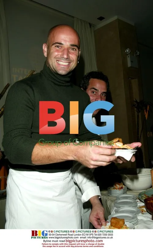 Agassi serves hors d'oeuvres with Lomonaco at NYC benefit