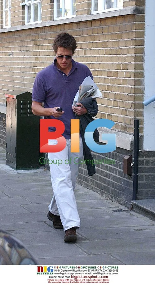 Hugh Grant Goes for Morning Walk