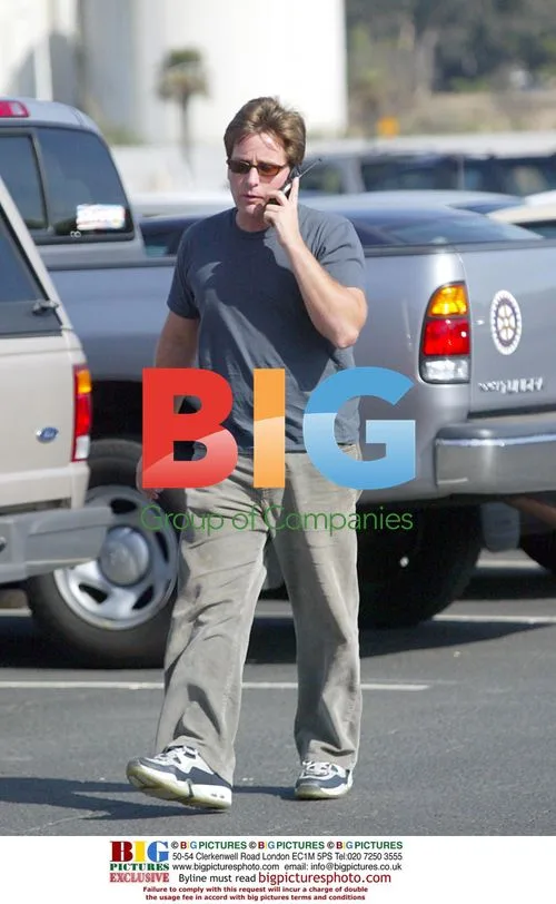Charlie Sheen and son Emilio Estevez visit bank in Oxnard