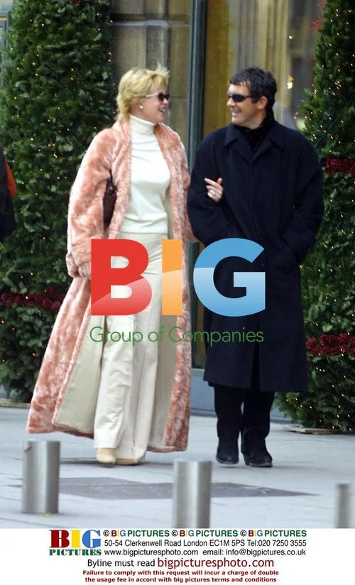 Celebrity in long fur coat and sunglasses