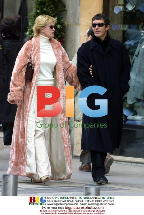 Celebrity in long fur coat and sunglasses