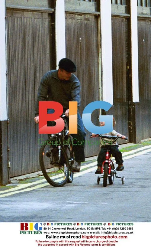 Guy Ritchie and son Rocco on bikes in London