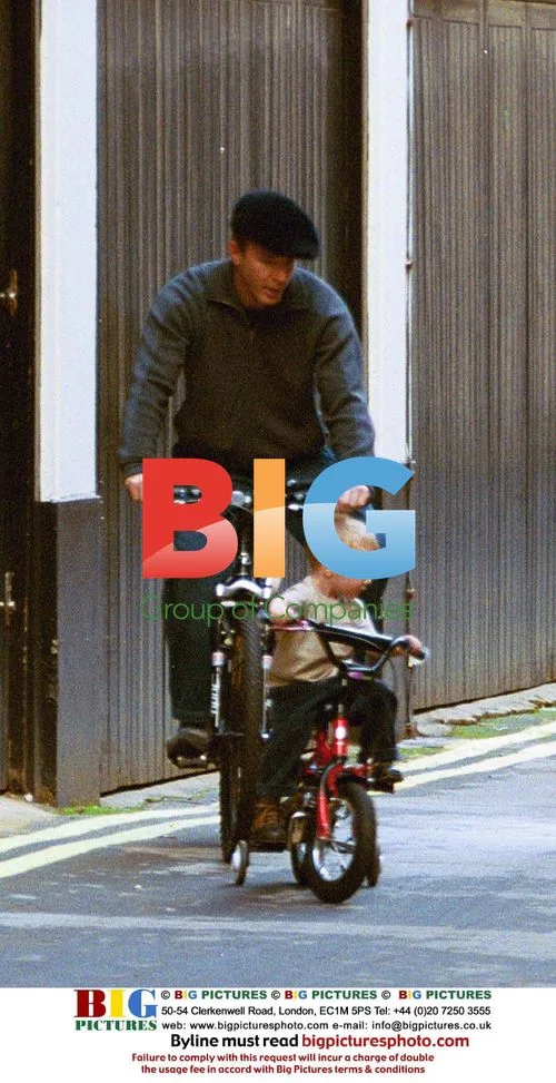 Guy Ritchie and son Rocco on bikes in London