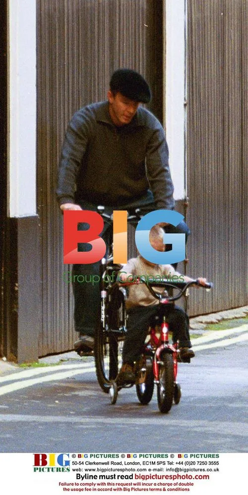 Guy Ritchie and son Rocco on bikes near home