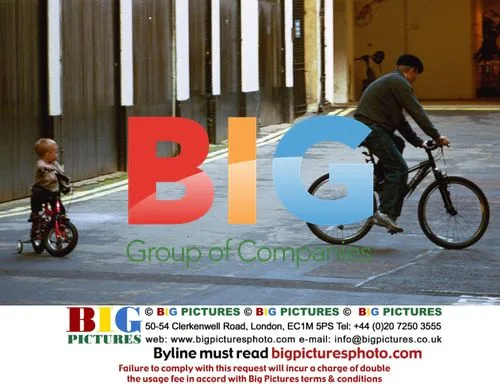 GUY RITCHIE AND SON ROCCO BIKE NEAR HOME