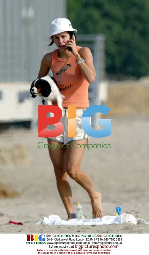 Courteney Cox with Puppy on Beach