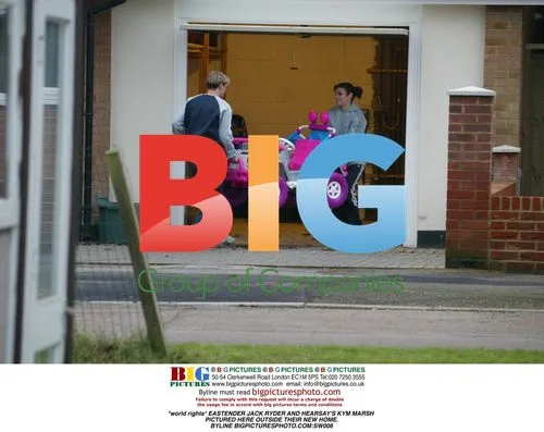 Jack Ryder and Kym Marsh Outside New Home