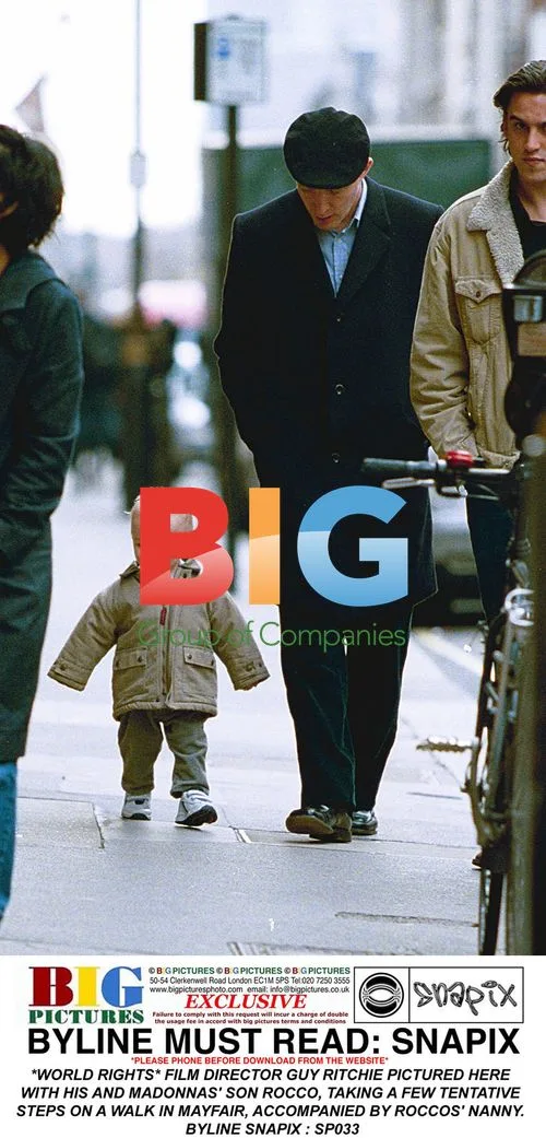 Guy Ritchie and son Rocco on walk in Mayfair