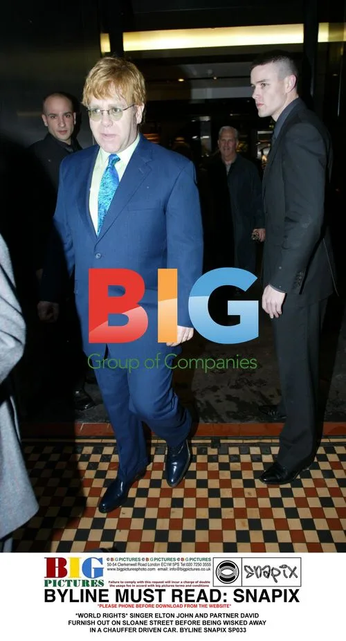 Elton John and David Furnish Leaving Sloane Street