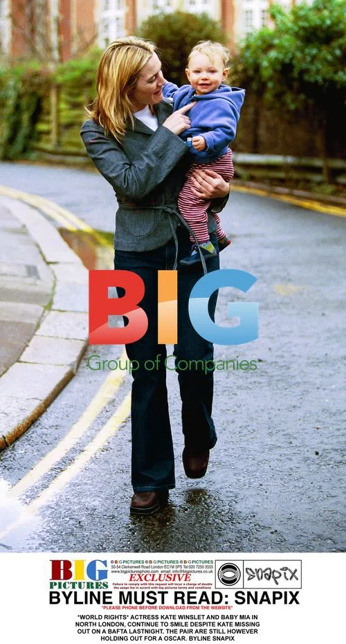 Kate Winslet and baby Mia smile in North London