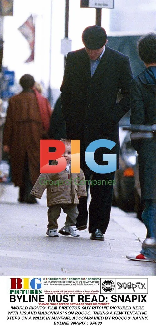 Guy Ritchie and son Rocco take walk in Mayfair