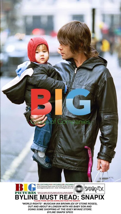 Ian Brown with baby son shopping in London