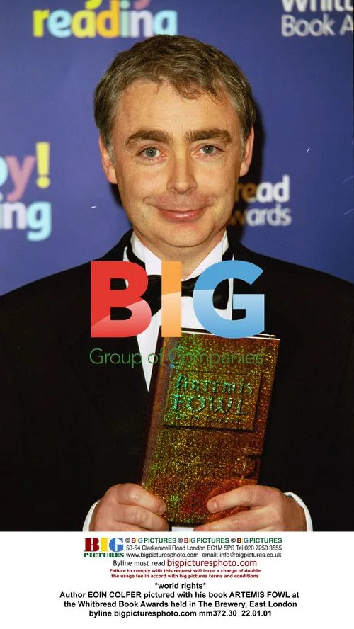 Eoin Colfer with Artemis Fowl Book