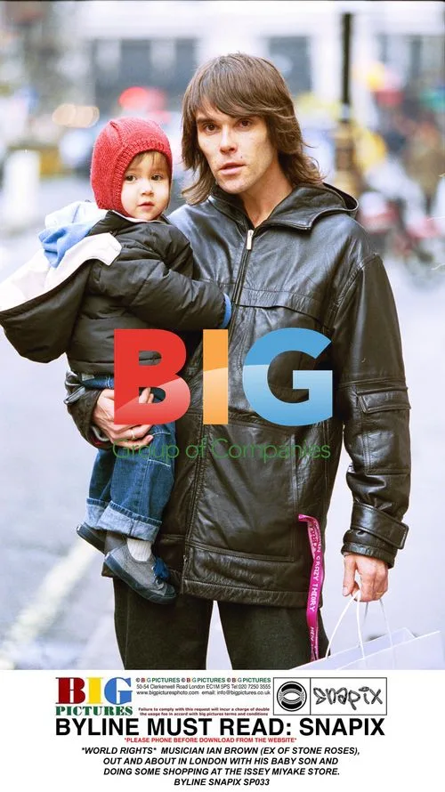 Ian Brown with Baby Son in London