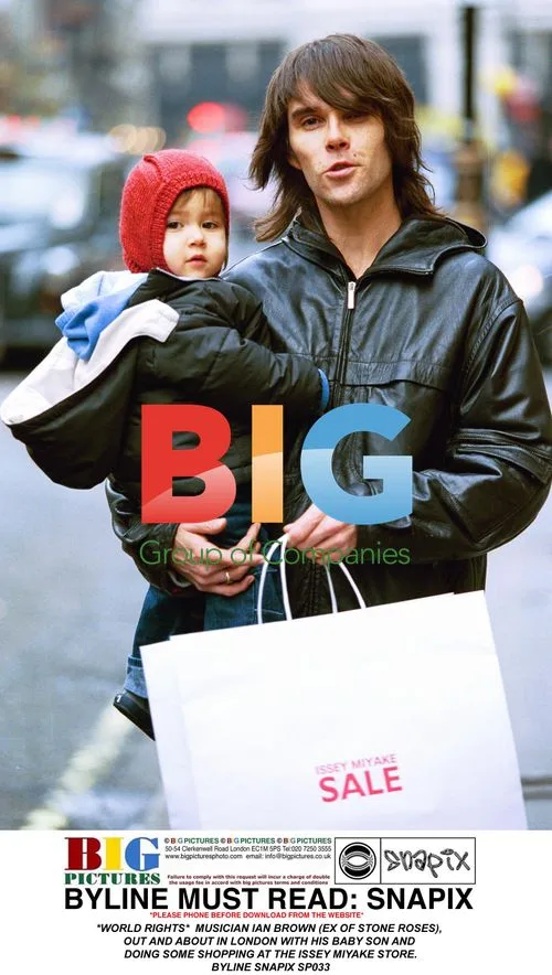 Ian Brown Out Shopping with Son in London