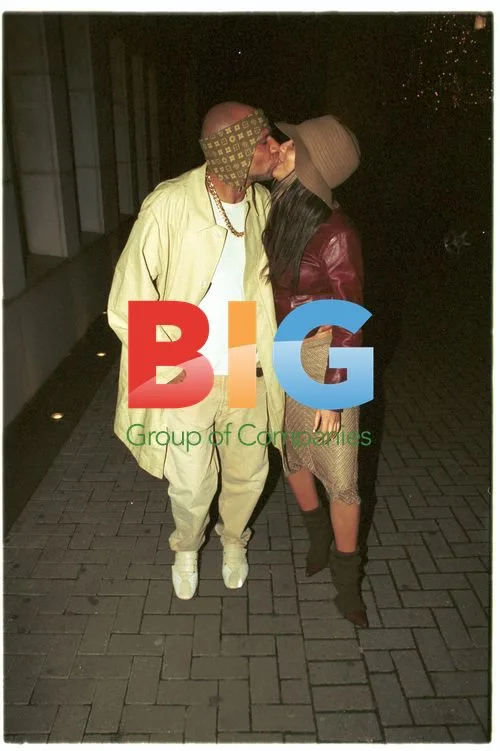 Goldie and girlfriend leaving London bar
