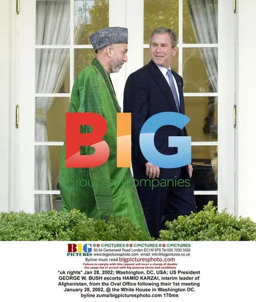 Bush Escorts Karzai from Oval Office