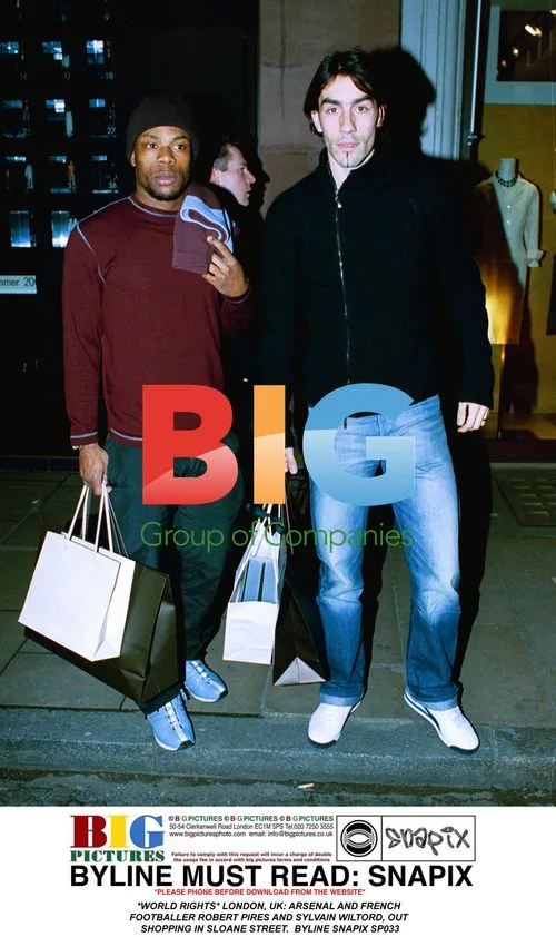 Arsenal footballers Pires and Wiltord shopping