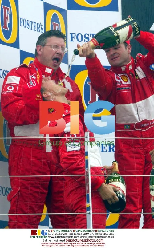 Michael Schumacher celebrates Silverstone win