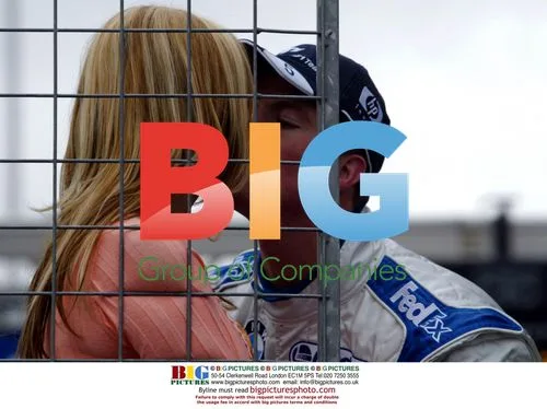 Ralf Schumacher gives wife Cora a pre-race kiss