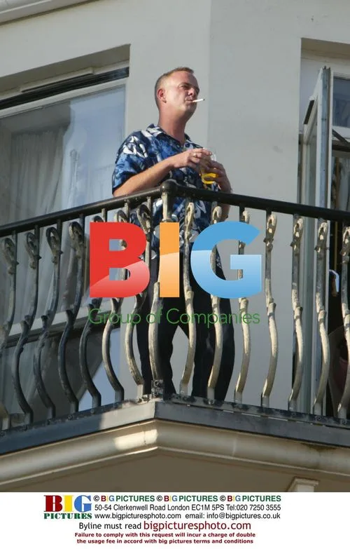 DJ Fat Boy Slim Greets Fans From Balcony
