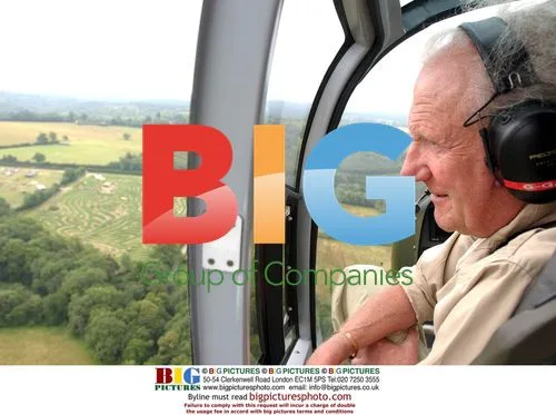 David Sheperd Looks Out Helicopter at Tiger Maize