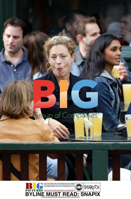 Alex Kingston enjoys a drink with husband in London