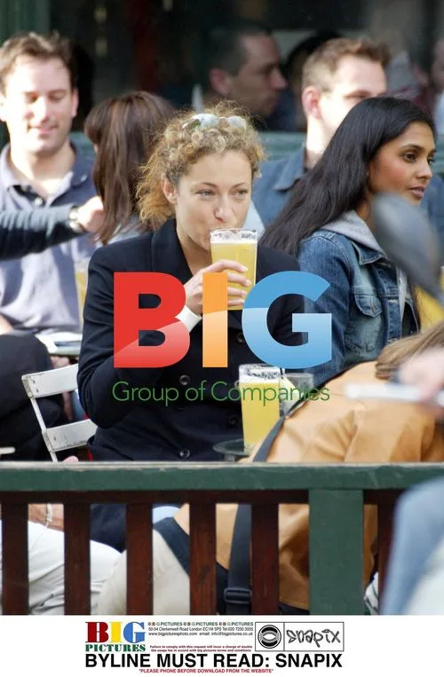 Alex Kingston enjoys a drink with friends in London