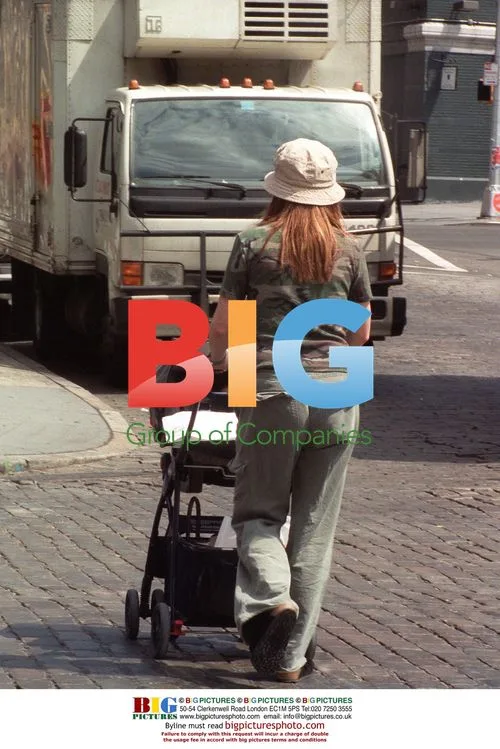 Julianne Moore with baby in Soho