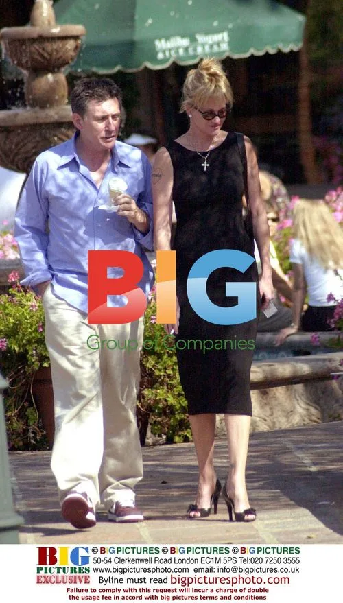 Melanie Griffith and Gabriel Byrnes stroll on Sunset Boulevard