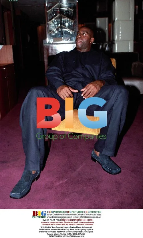 Magic Johnson signs Lakers court at Memorial Day event