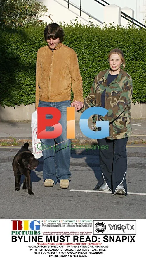 Pregnant TV host Gail Hipgrave and husband Dan walk puppy